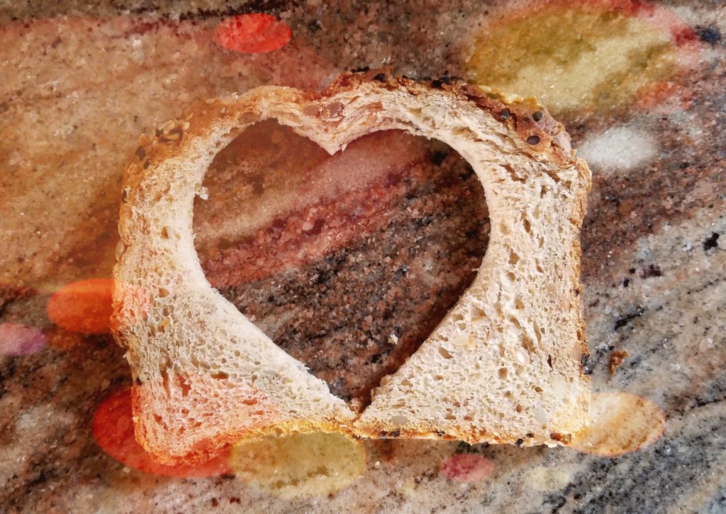 bread crust with heart shape cut from middle