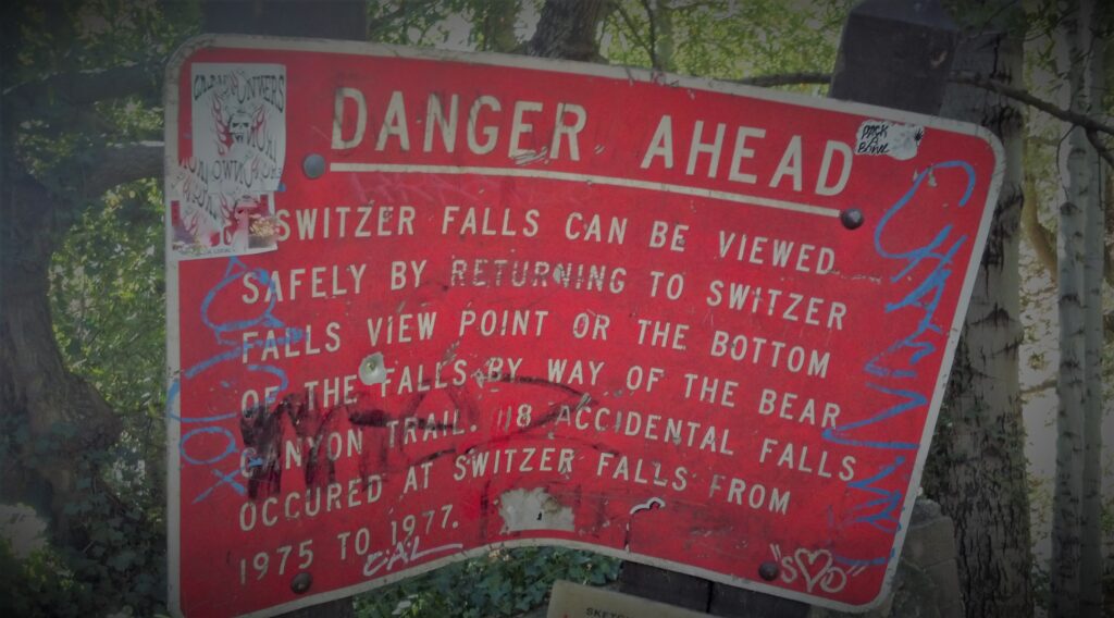 Red sign reads "DANGER AHEAD"