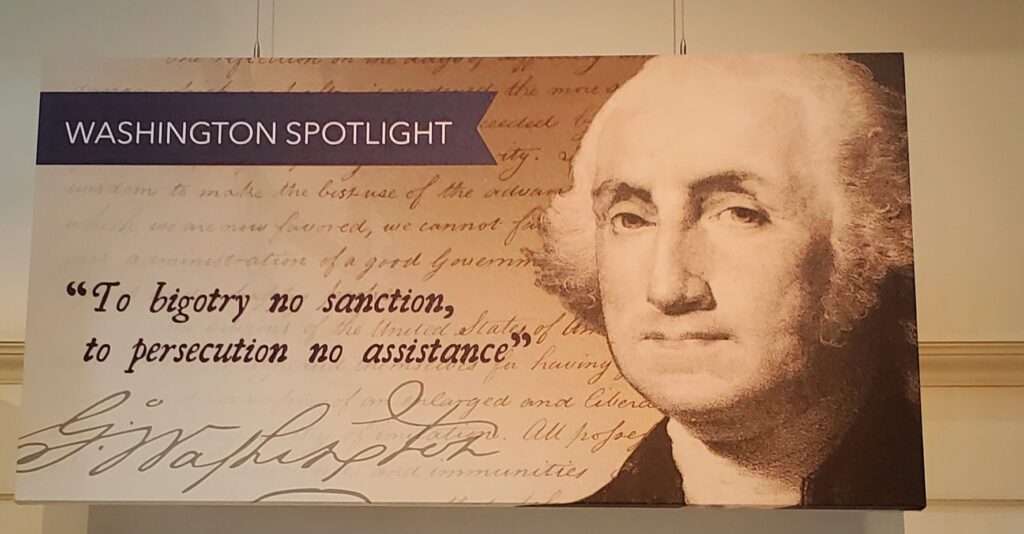 Image of a quote by President George Washington that reads, "To bigotry no sanction, to persecution no assistance," as posted at the Skirball Cultural Center in Los Angeles, February 2025